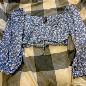 Floral crop top with tiny white flowers.On shoulder or off.